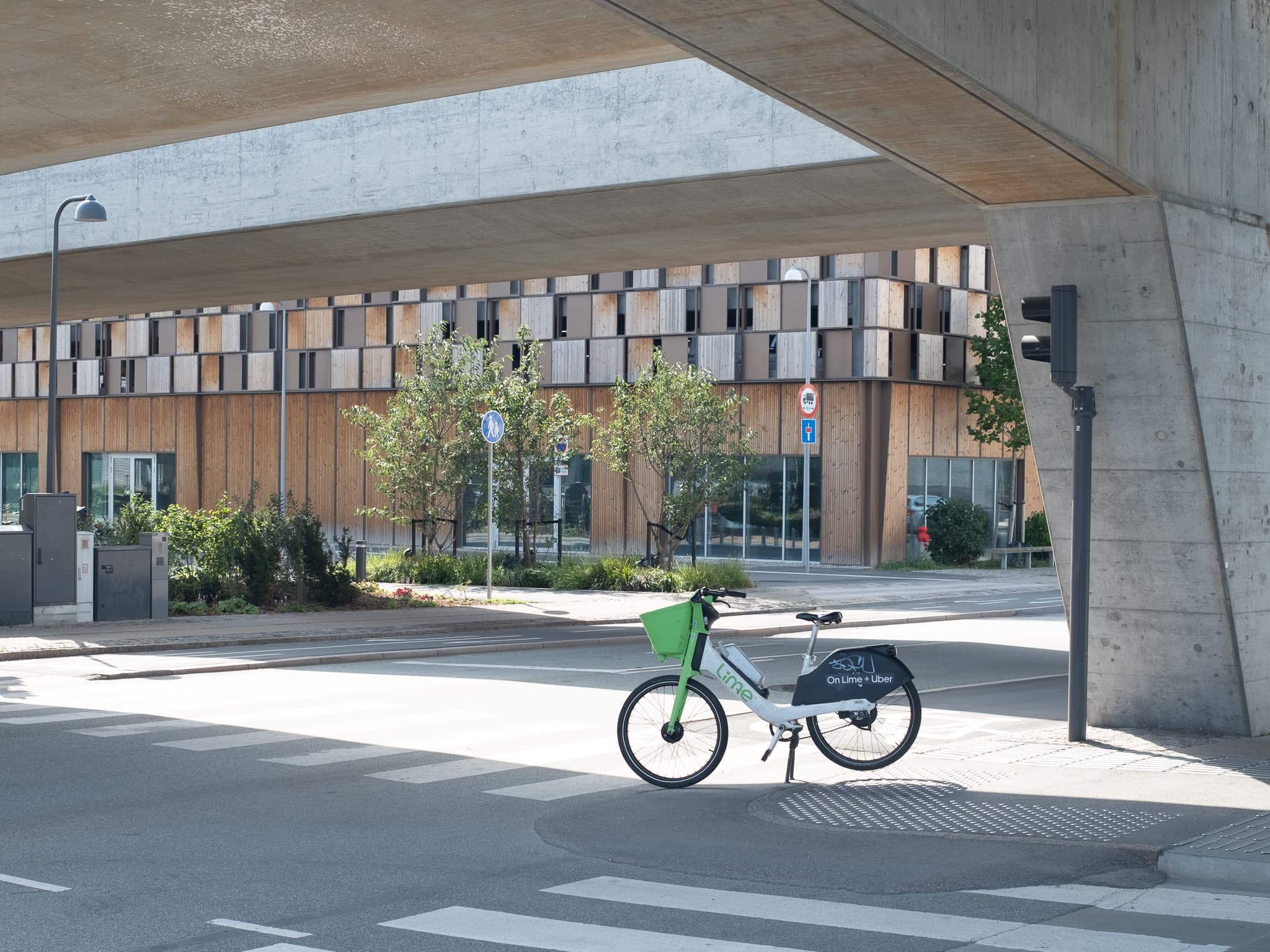 A Lime bike beneath the Copenhagen Metro